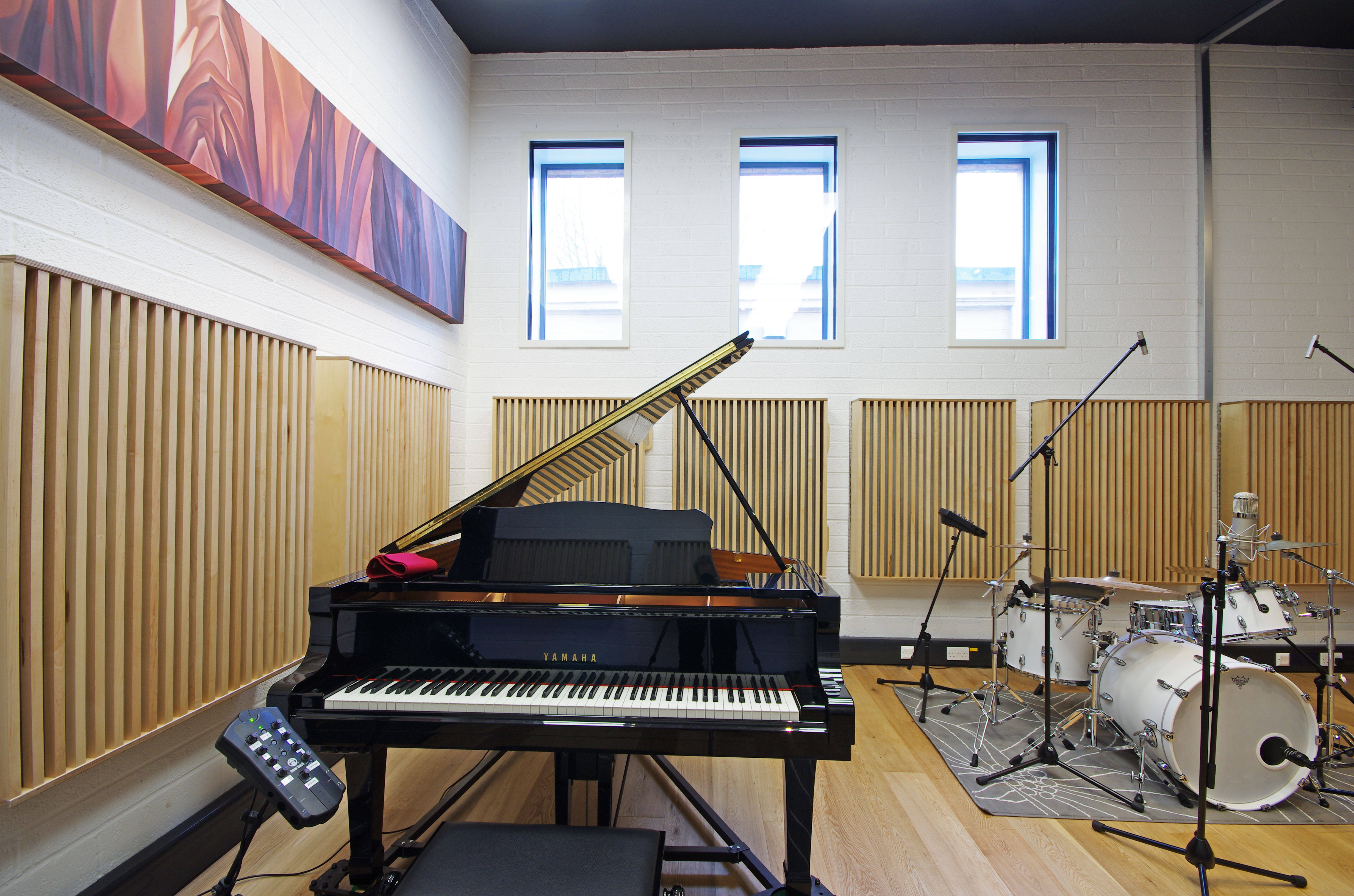 A rehearsal room including a piano